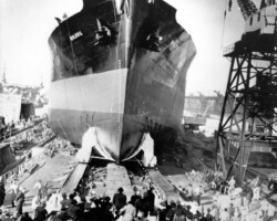 Norfolk, Va., Febr. 26th, 1949. Tanker launching.
<em>SS Bulkoil</em>, 30.000-ton supertanker, slides into Hampton Roads as hundreds watch launching sistership of the <em>Bulkpetrol</em>, one
of the world a largest tankships. Sponsor was Mrs. H. Wilkinson, of New York, wife of the president of the Asiatic Petroleum
Corporation, charterers of the ship.
( AP wire photo )