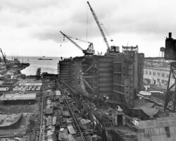 6 January, 1950 - The holidays are over and most of the destroyers and even the tender have pulled out. Work continues on the <em>Bulktrader</em>.
( Photo Copyright Thomas Fred Wright Jr. )