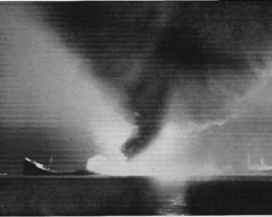 <em>Phoenix</em> and <em>Pan Massachusetts</em> after colliding on the night of 5 Jun 1953. The empty <em>Phoenix</em> exploded and sank quickly while fully laden <em>Pan Massachusetts</em> burned fiercely.